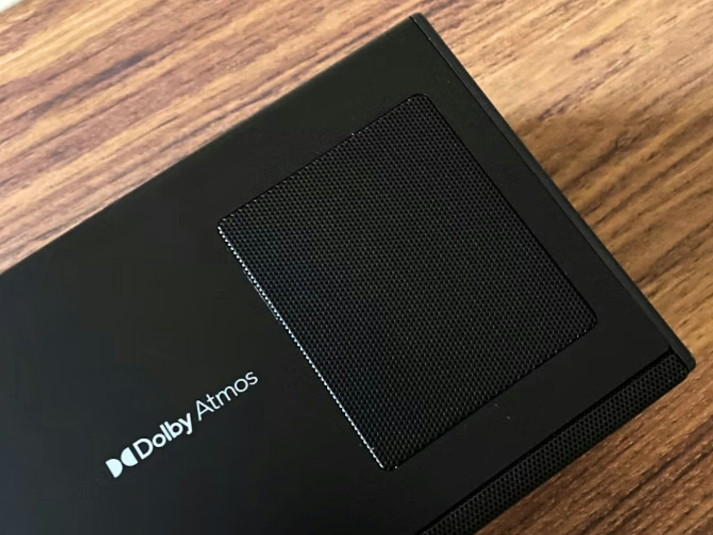 An upward-firing speaker on a Dolby Atmos soundbar