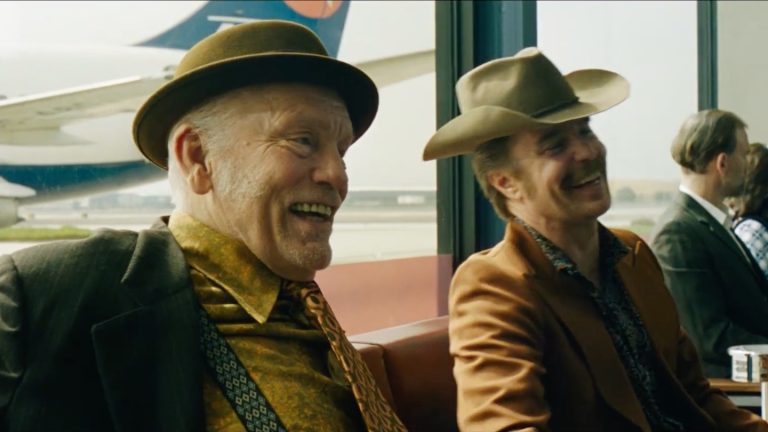 Martin McDonagh’s Wild Horse Nine Trailer Sends CIA Agents John Malkovich & Sam Rockwell To Easter Island