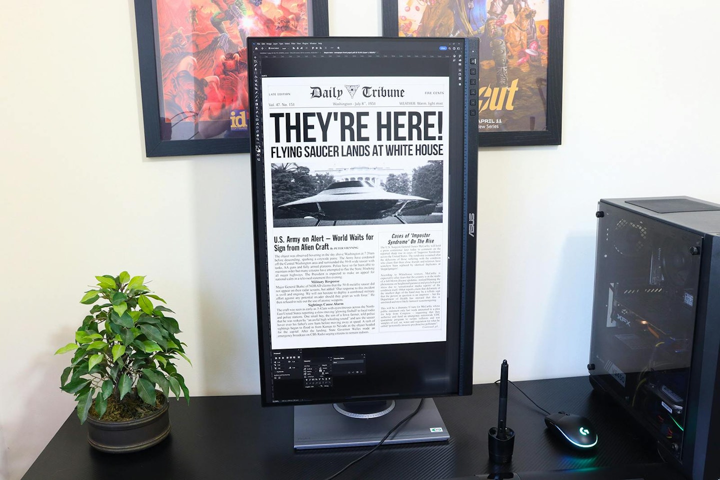 ASUS ProArt Display PA278QV monitor on desk showing fake alien newspaper report.