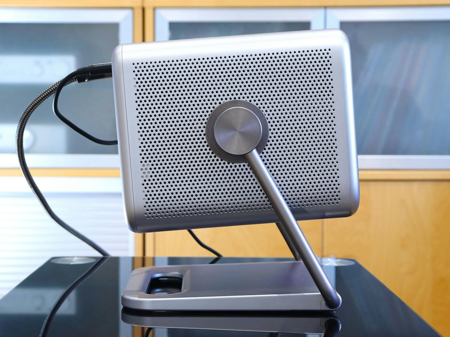 Hisense M2 Pro projector on a table in a lounge - side view