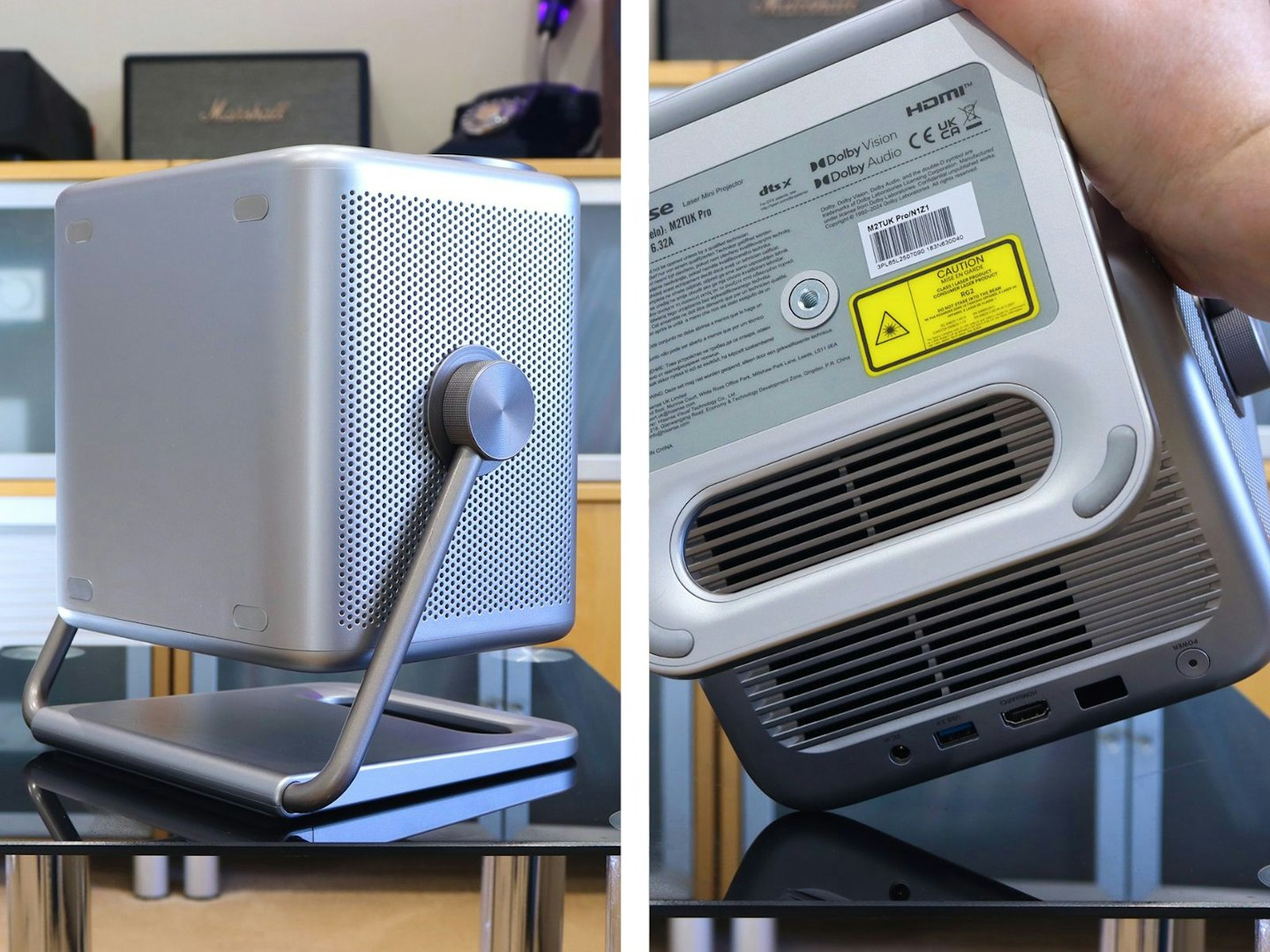 Hisense M2 Pro projector on a table in a lounge - tilted upward, and underside mount